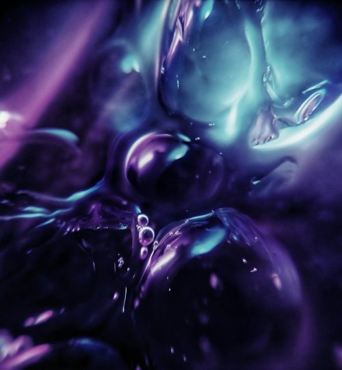 A vivid abstract image with flowing purple and blue hues creating a mesmerizing effect.